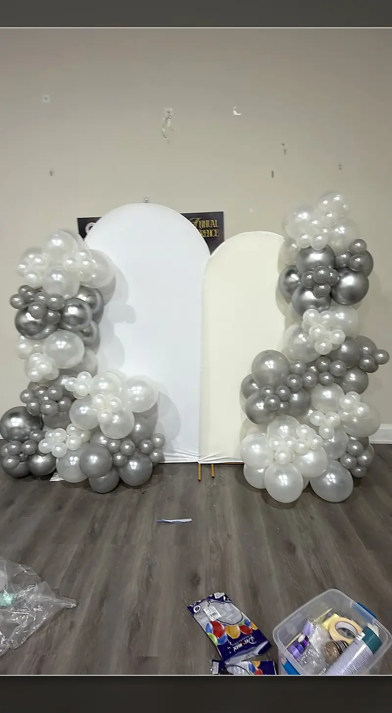 Silver birthday decoration installation before event