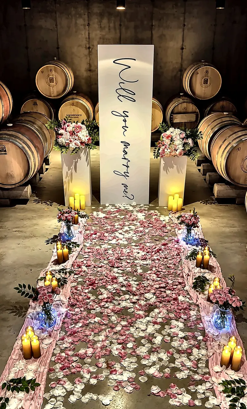 Fivelle proposal styling, floral petals and candlelight